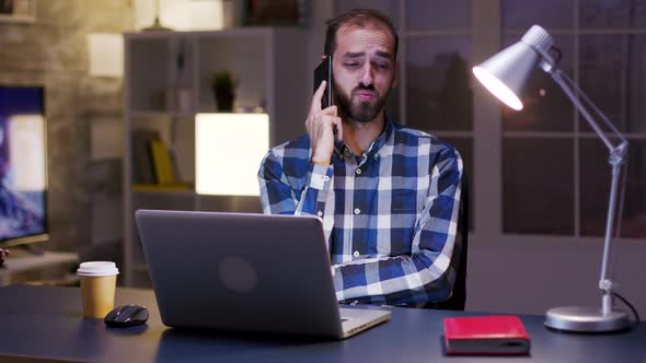 Young Entrepreneur Yawn While Having a Conversation on the Phone