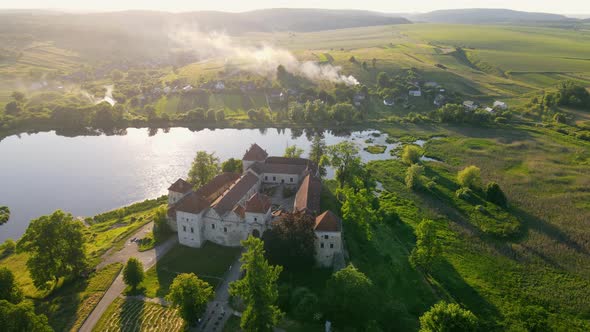 Castle Near the Lake From a Bird's Eye View at Sunset