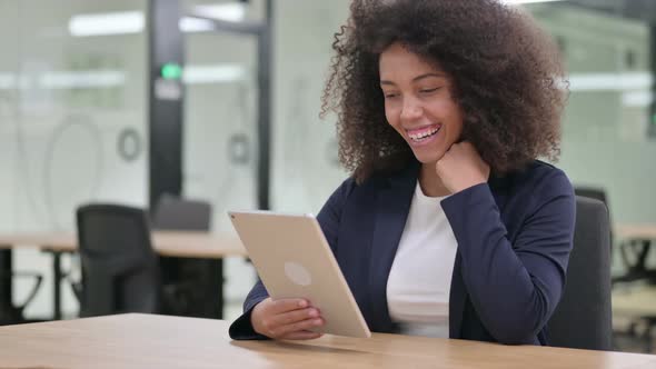 African Businesswoman Talking During Video Chat on Tablet