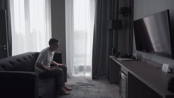 Man Resting in a Hotel Room