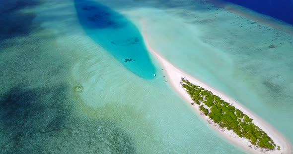 Wide angle overhead copy space shot of a white paradise beach and turquoise sea background in colour