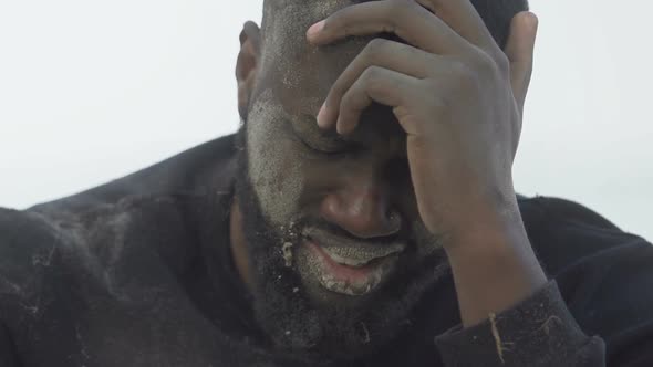 Deeply Upset Afro-American Male Looking at Camera, Natural Disaster Victim