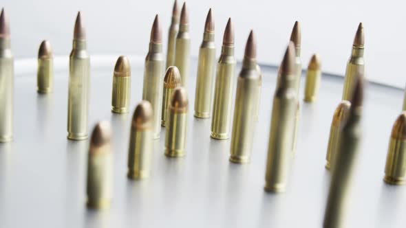 Cinematic rotating shot of bullets on a metallic surface - BULLETS 081