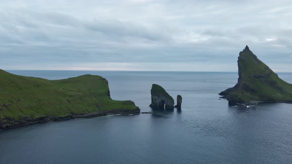 Drone Towards Drangarnir Sea Stacks In Faroe Islands