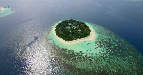 Aerial drone view of scenic tropical islands in the Maldives.