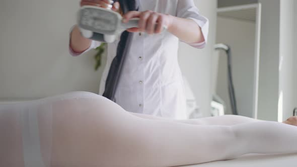 LPG Massage in Modern Beauty Clinic Anti Cellulite Treatment Cosmetologist is Massaging Buttocks