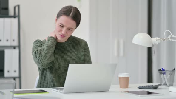 Young Woman Having Neck Pain at Work