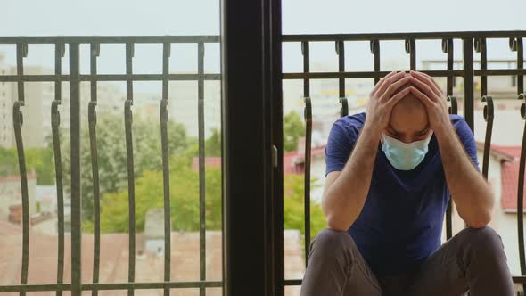 Pensive Man with Disposable Mask