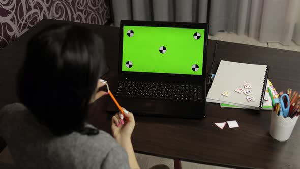 Woman Teacher Making Online Distance Education Video Call on Laptop Green Screen