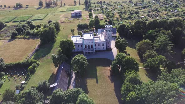 Vecauce Manor in Latvia Aerial View of the Pink Castle Through the Park.View From Above. 