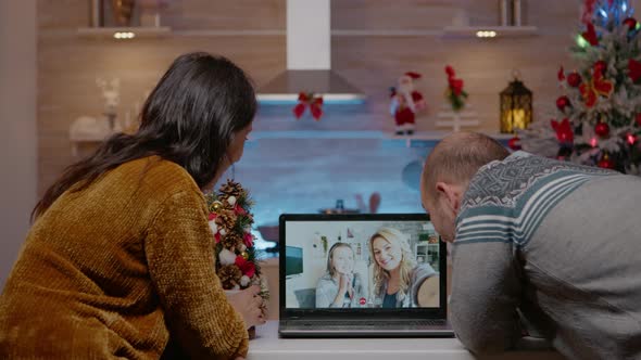 Couple Using Video Call Communication with Family