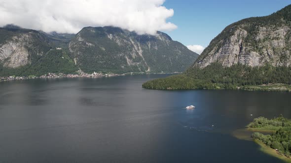 Aerial view Lake Hallstätter See, boat and mountains Alps, Hallstatt, Austria