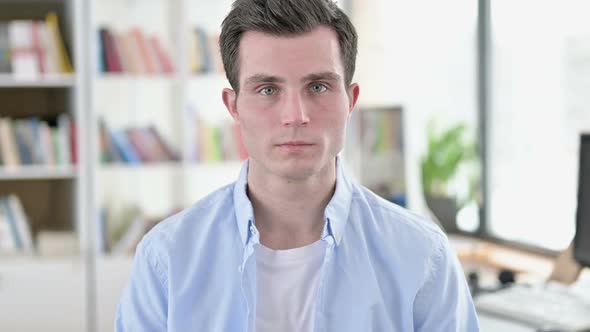 Smiling Young Man Student Looking at Camera