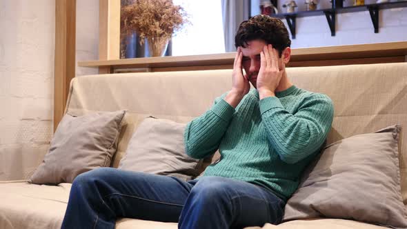 Man with Headache Frustration and Tension at Home