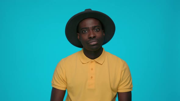 Portrait of African Man Rolling Eyes and Groaning at Studio