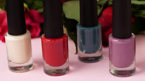 The slider of movement of nail polishes of different colors. Video close-up of nail polishes