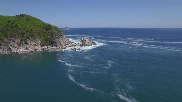 View From a Droneon a Stone Cape Washed By Strong Waves