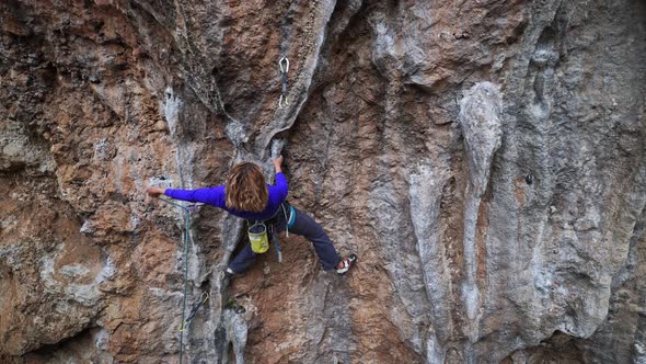 Slow Motion of Strong Woman Rock Climber Confidently Rock Climbs Mountain Fitness Lifestyle