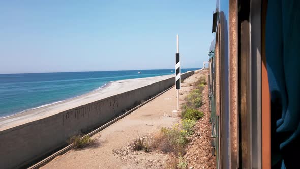 Look Out the Window of a Train in Calabria Near the Sea