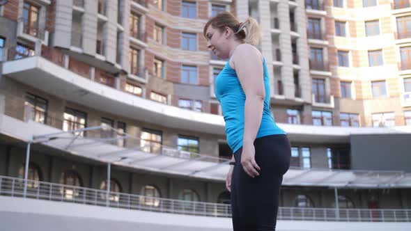 Plus Size Female Stretching Muscles Before Running