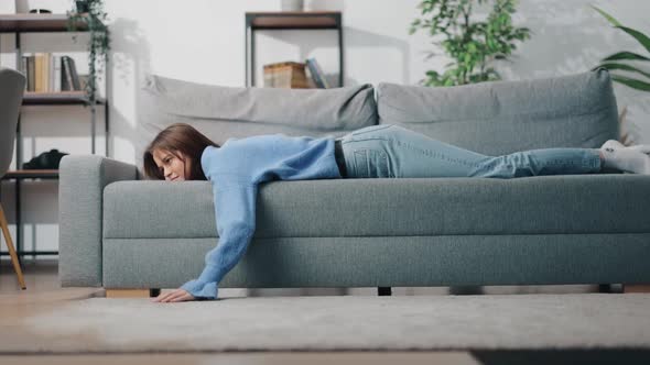 Tired Woman Relaxing on Couch