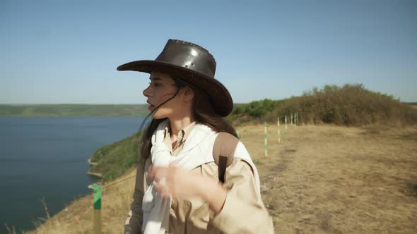 Woman with Backpack Walking at Bakota Area