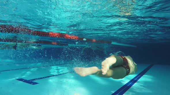 Underwater View Swimmer Swiming Crawl Stroke in the Pool