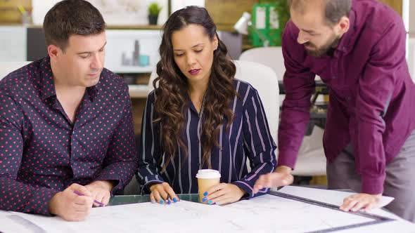 Construction Owner Talking with His Architects Team