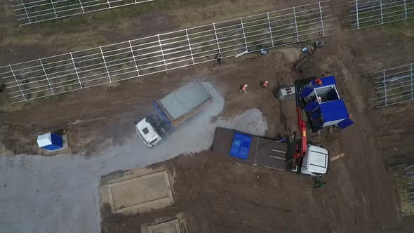 Top View of the Construction Work on a Solar Power Station Machinery and People