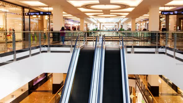 Shopping Mall Escalator Crowd Traffic Time Lapse. Pan Up