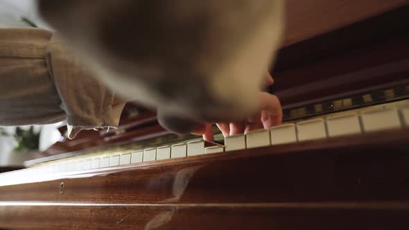 Woman Playing on Vintage Wooden Piano