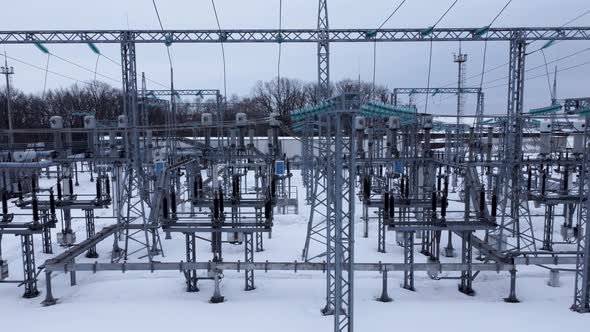 Aerial view of a high voltage electrical substation in winter season.