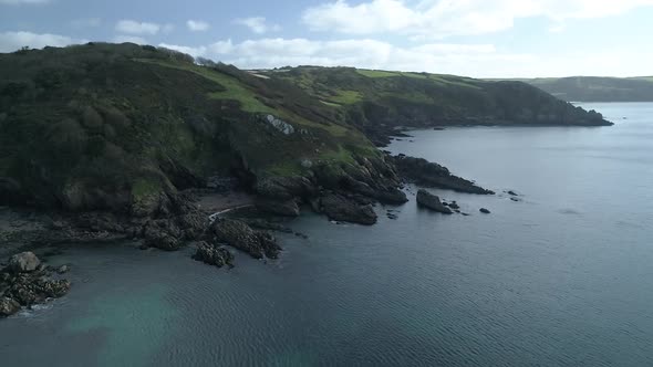Aerial view of coast line, Caerhays Cornwall England UK, filmed from drone