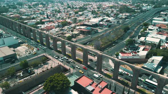 View of normal traffic and arches in downtown Queretaro