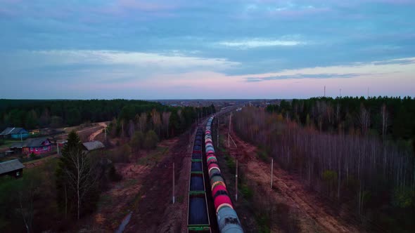 Two Trains with Coal and Oil Move Past Each Other