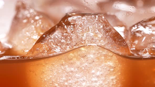 Ice Cubes in a Caramelly Brown Liquid