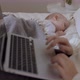 Closeup Laptop Keyboard Near Sleeping Baby in Bedroom - VideoHive Item for Sale