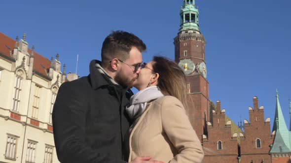 Young couple kissing in old town in Wroclaw, Poland