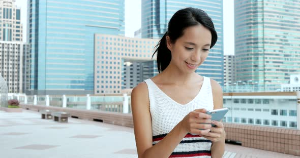 Woman using smart phone at outdoor 