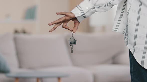 Closeup Focus on Apartment Keys in Hand of Unrecognizable African American Woman Homeowner Buying