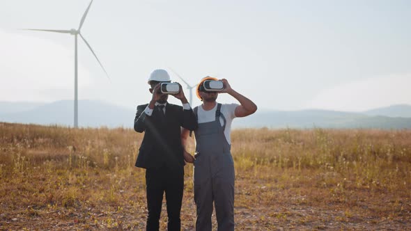 African American Businessman and Indian Engineer Wearing VR Headset During