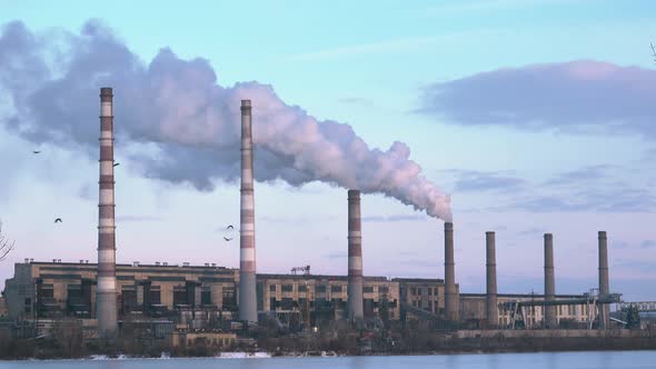 Polluting Factory at Sunset