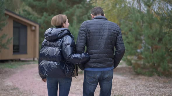 Live Camera Follows Happy Loving Caucasian Couple Strolling Outdoors Holding Hands