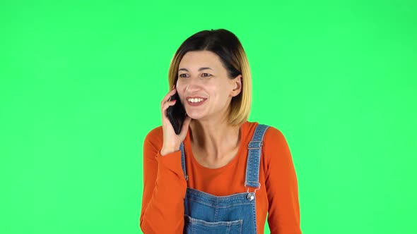 Girl Talking for Mobile Phone, Very Shocked Then Rejoice. Green Screen