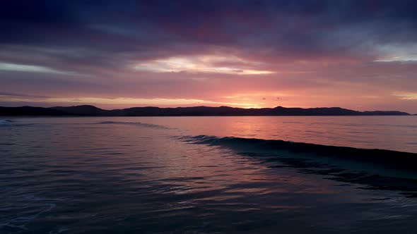 Sunset Sky, Sea And Mountain View In Spirits Bay, New Zealand - aerial drone shot