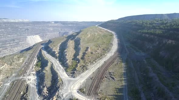 Aerial Ground Roads for Trucks Meander Around Asbestos Pit