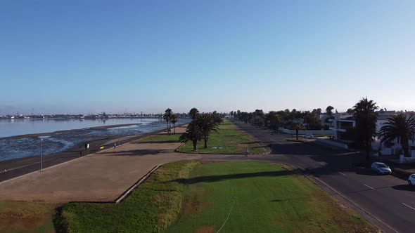 Beautiful embankment with green lawn and trees, Walvis Bay, Namibia