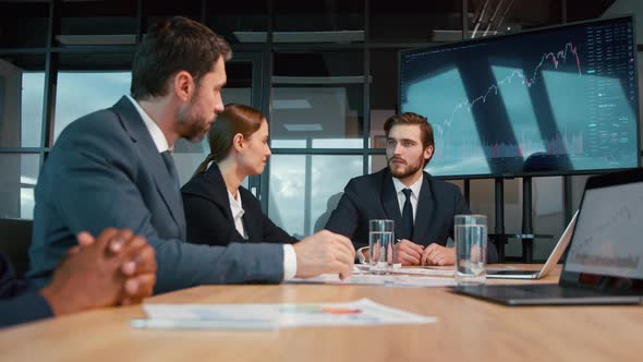 Business analysts discussing a project at a meeting in the office