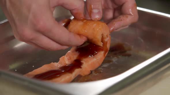 Culinary Specialist Is Spinning To Roll a Marinated Fish Fillet, Close-up