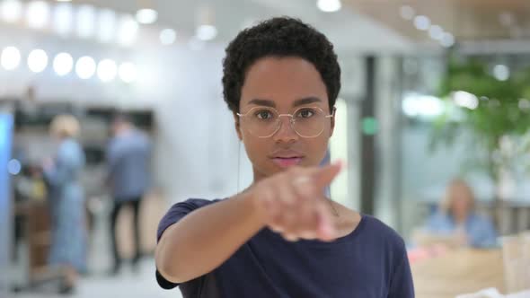 Portrait of Casual African Woman Pointing at the Camera